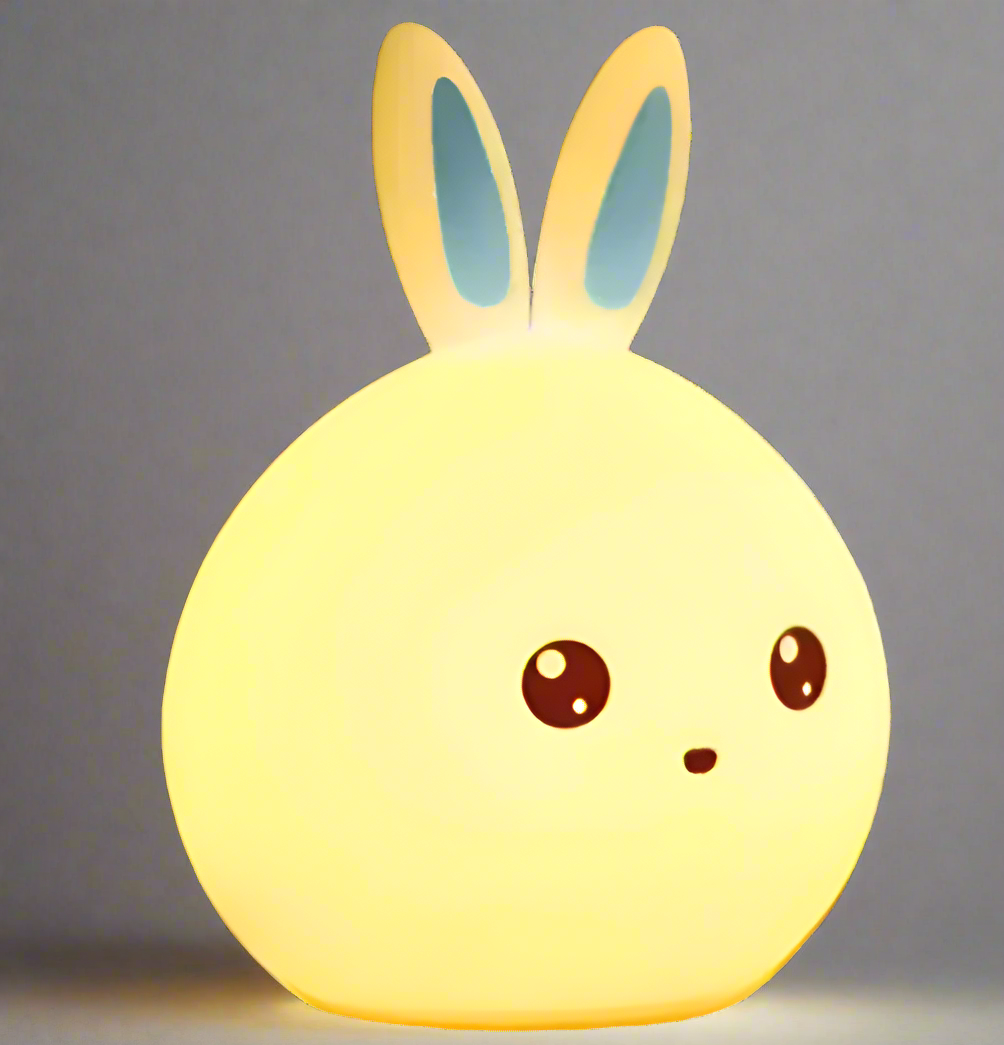 Round silicone night light shaped like a cute rabbit's face, featuring long pink ears and playful facial features with large brown eyes and a small, smiling mouth. Ideal for children's rooms as a touch-activated, color-changing LED lamp.