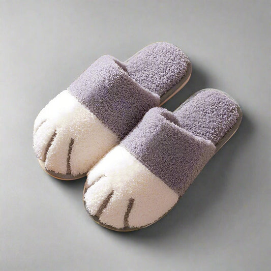 Gray and white fluffy paw-shaped slippers for autumn and winter, designed for women. Cozy indoor floor shoes ideal for bedrooms, featuring a kawaii style. Suitable for couples, these warm flat footwear slides add comfort and style to any home setting."